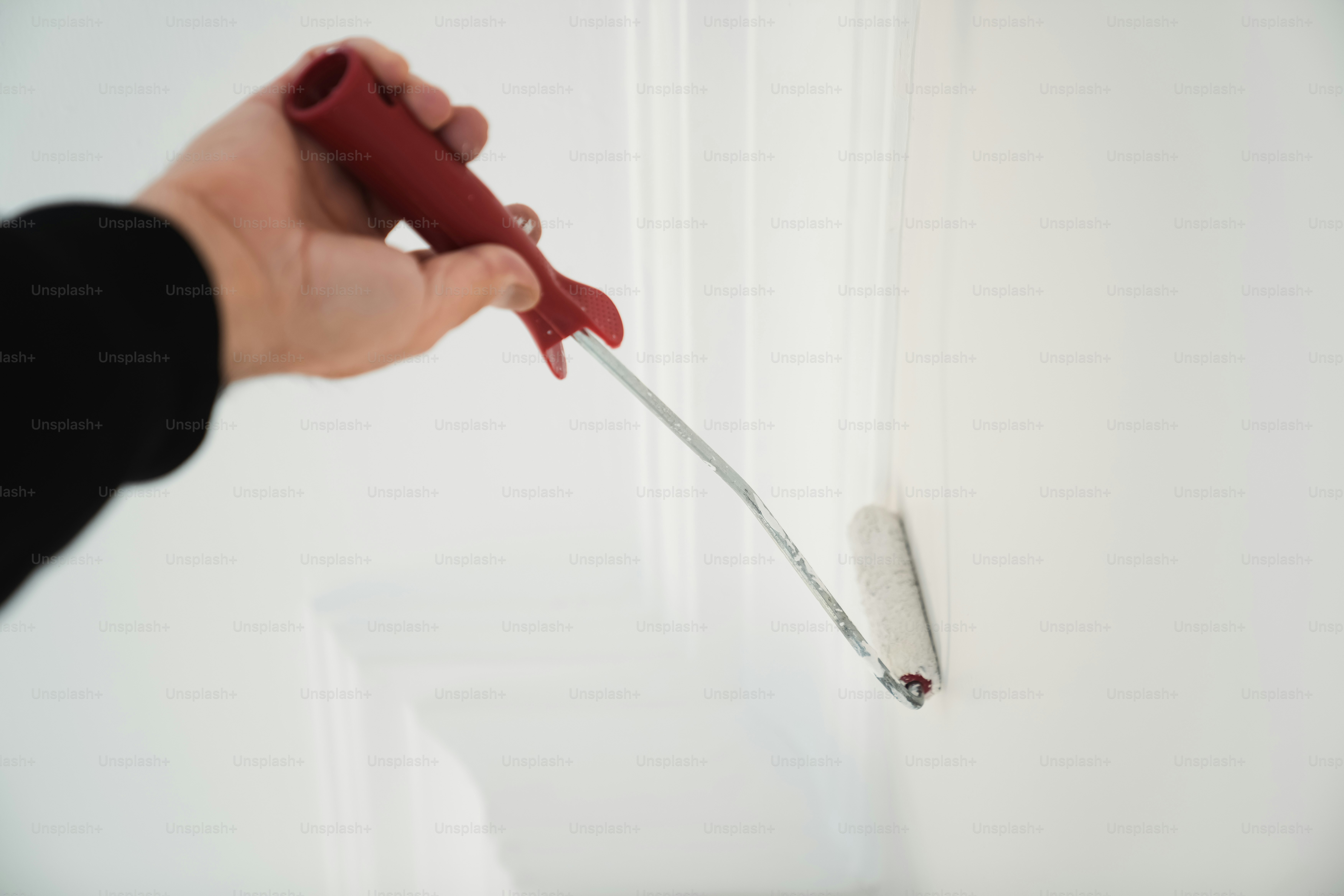 a person holding a pair of scissors in their hand