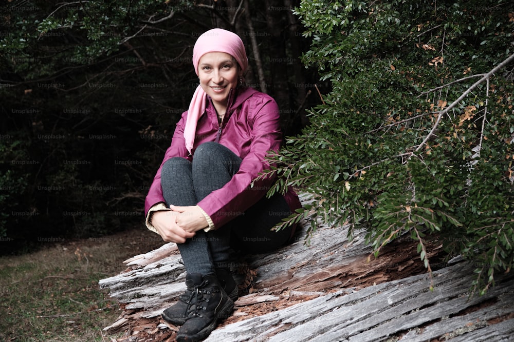 Optimistic woman after cancer chemotherapy enjoys nature and smiles.