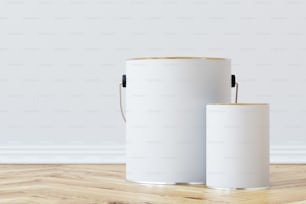 Close up of a white paint bucket standing on a wooden floor against a white wall with a smaller tin can near it. 3d rendering mock up