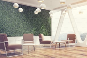 Side view of an office cafe interior with a large grass wall, panoramic windows with triangular frames, white round tables and soft brown chairs near them. 3d rendering mock up toned image
