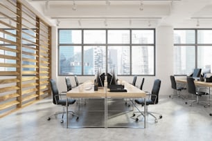 Open space office interior with long wooden tables, computers standing on them, black chairs and plank walls. Side view. 3d rendering