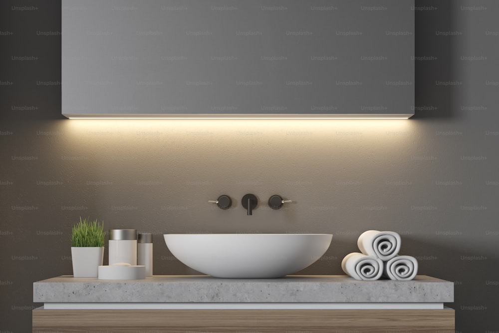 Close up of a white sink standing on a wooden set of drawers in a gray bathroom. 3d rendering mock up