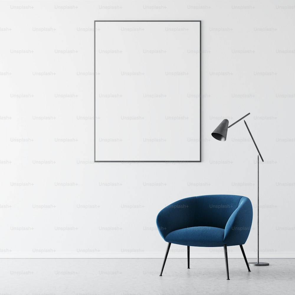 Living room interior with white walls, a concrete floor and a dark blue armchair standing near a lamp. A poster. 3d rendering mock up