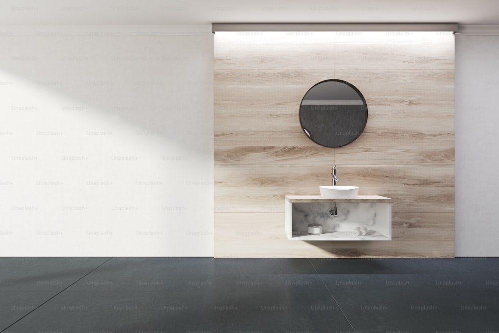 Minimalistic bathroom interior with concrete and wooden walls, a black tiled floor and a sink with a round mirror above it. 3d rendering mock up