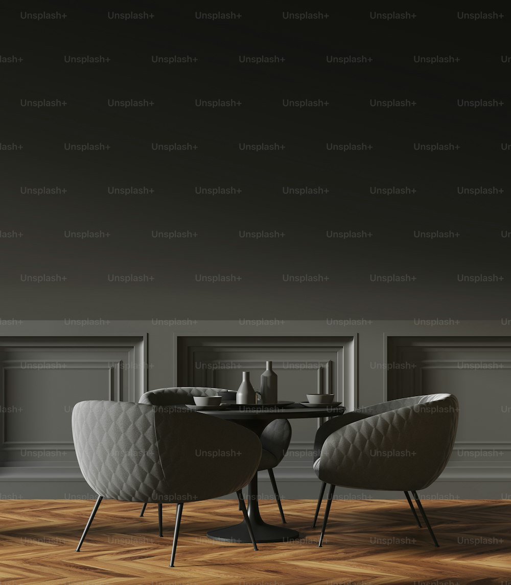 Black round table standing in a cafe with gray chairs near it and a dark gray wall in the background. 3d rendering mock up