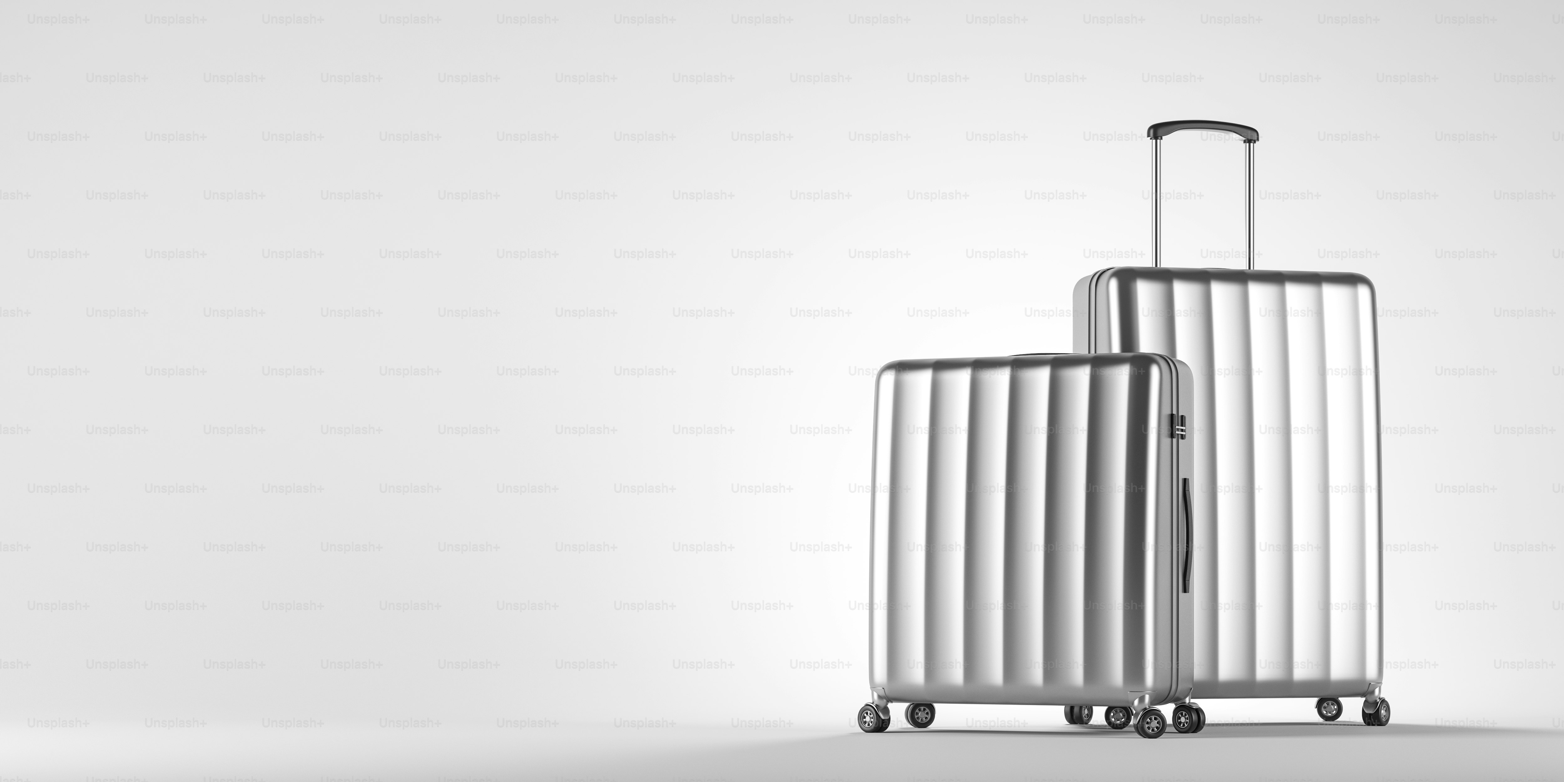 Two stylish silver suitcases standing over white background. Concept of tourism and travelling. 3d rendering mock up
