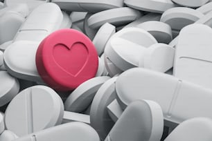 Una pillola rossa con il segno del cuore tra tante pillole bianche il concetto di scelta e differenza. Soluzioni per il settore sanitario. Illustrazione di rendering 3D. Pillola d'amore
