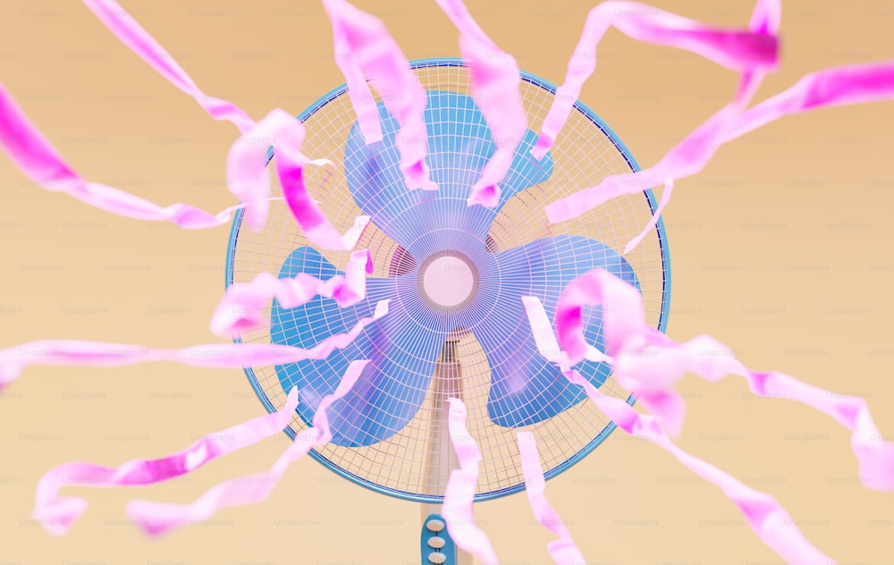 vista frontal de um ventilador azul com fitas cor-de-rosa esvoaçantes. Renderização 3D