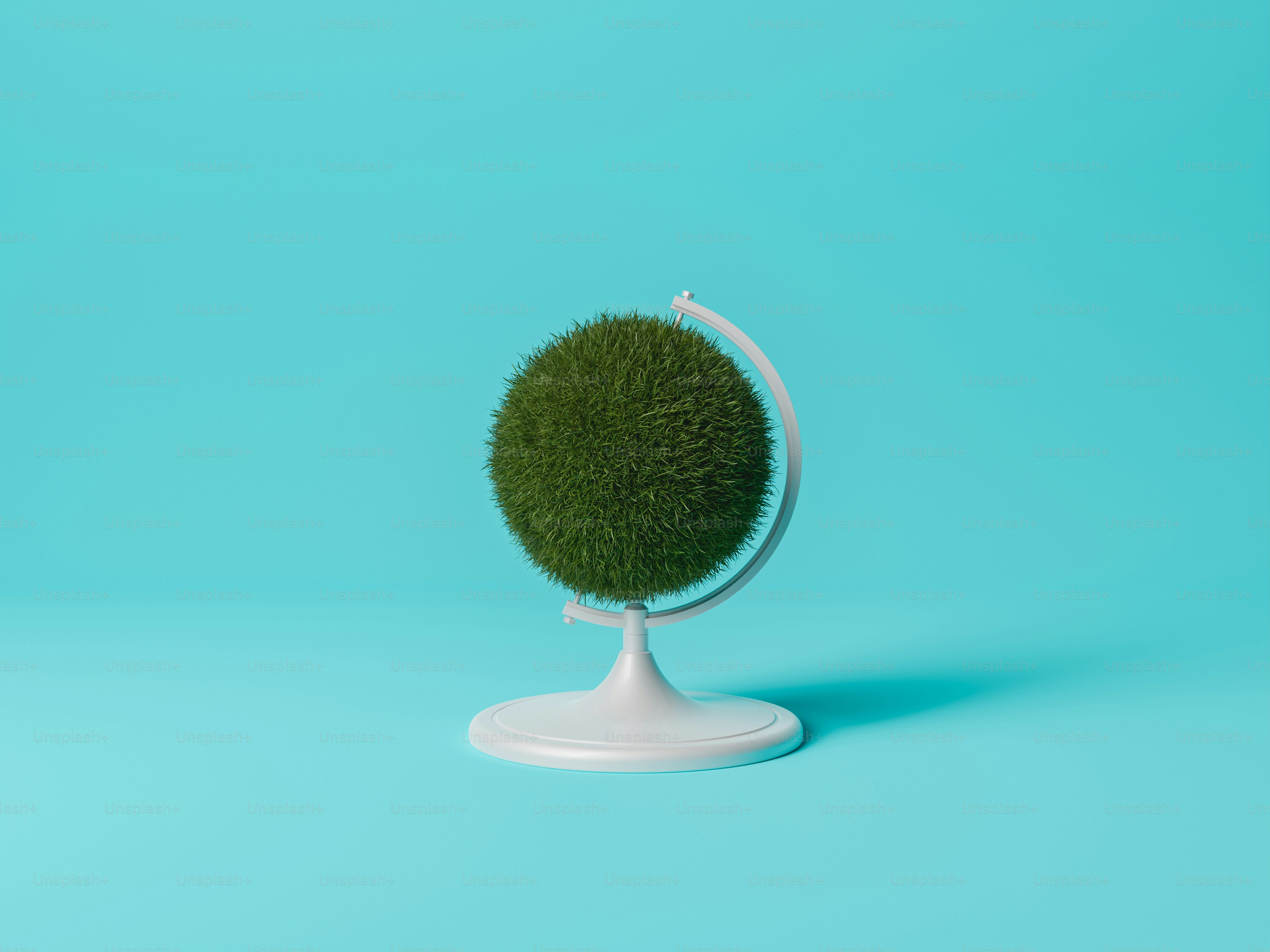 grass earth globe on blue background. minimal concept of ecology and environment. 3d rendering