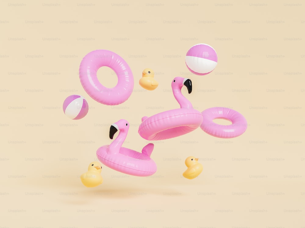 Representación 3D de bolas de flamenco inflables rosas y anillos de natación con patos de goma amarillos sobre fondo beige