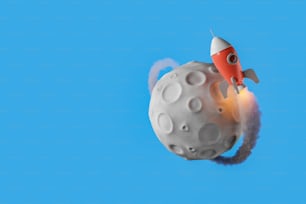달을 공전하고 연기의 흔적을 남기는 작은 로켓. 복사 공간. 3D 렌더링