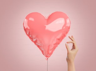 mano con uno spillo accanto a un globo a forma di cuore. Concetto di San Valentino, crepacuore, amore e tensione. Rendering 3D
