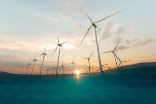 Desde abajo de molinos de viento colocados en el campo cerca del mar azul en la noche de verano que muestran el concepto de fuente de energía de renovación. Renderizado 3D