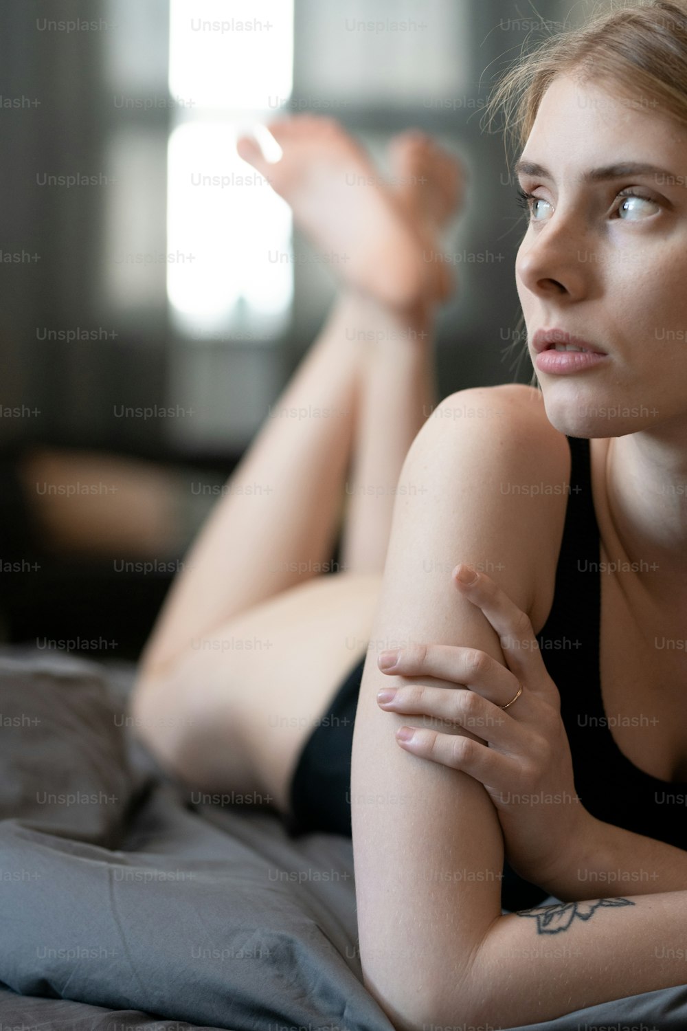 Close-up of beautiful young woman in underwear lying on bed in the room  photo – Cozy Image on Unsplash