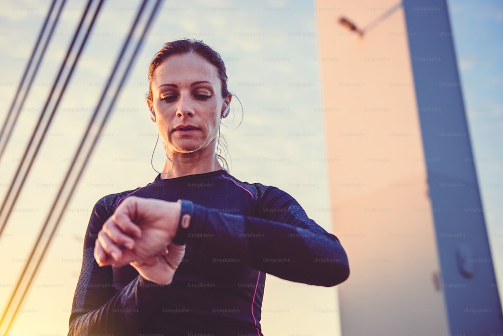 Woman monitoring her progress on smart watch