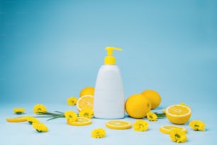 a bottle of soap surrounded by lemons and flowers