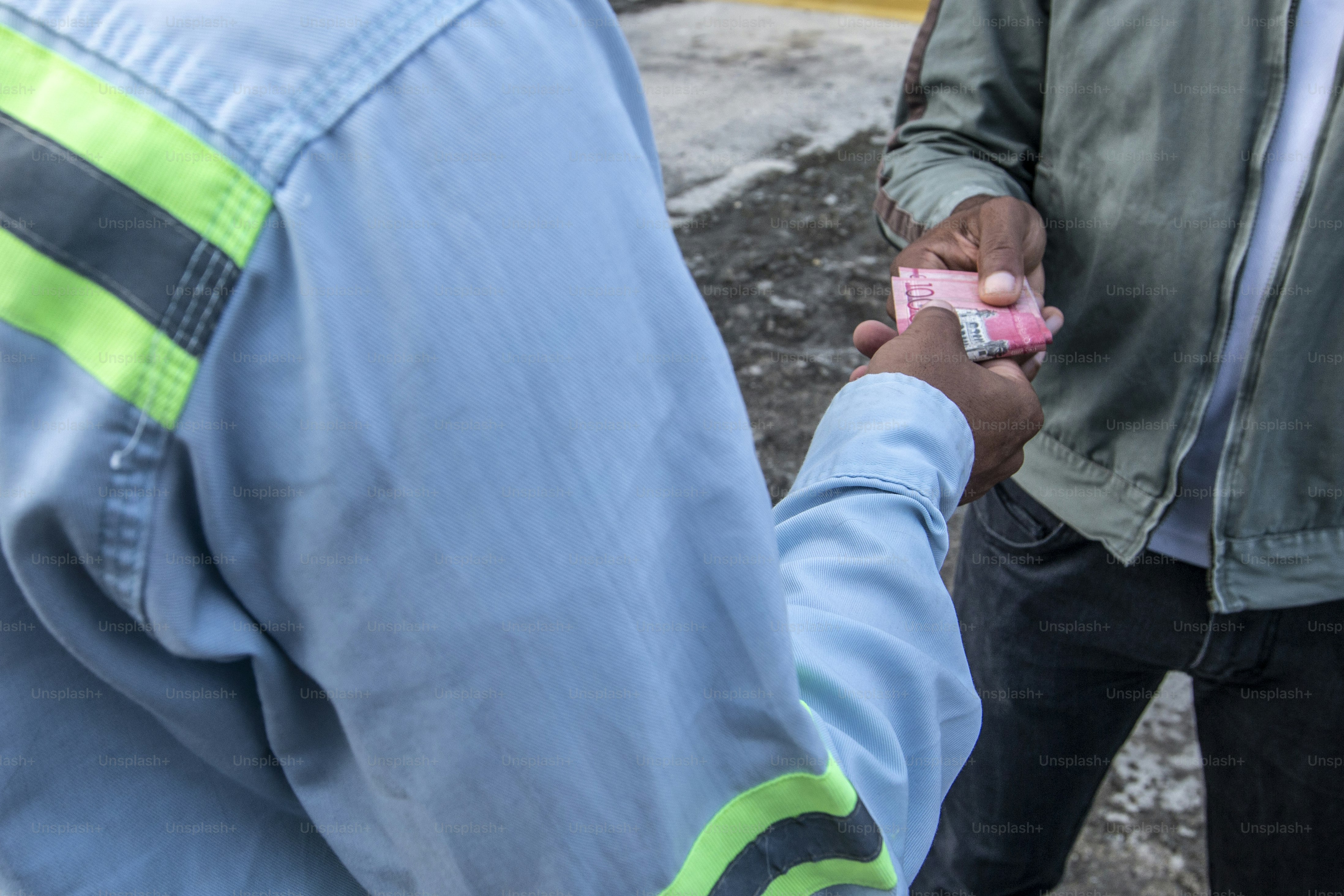 a man holding a pink object in his hand