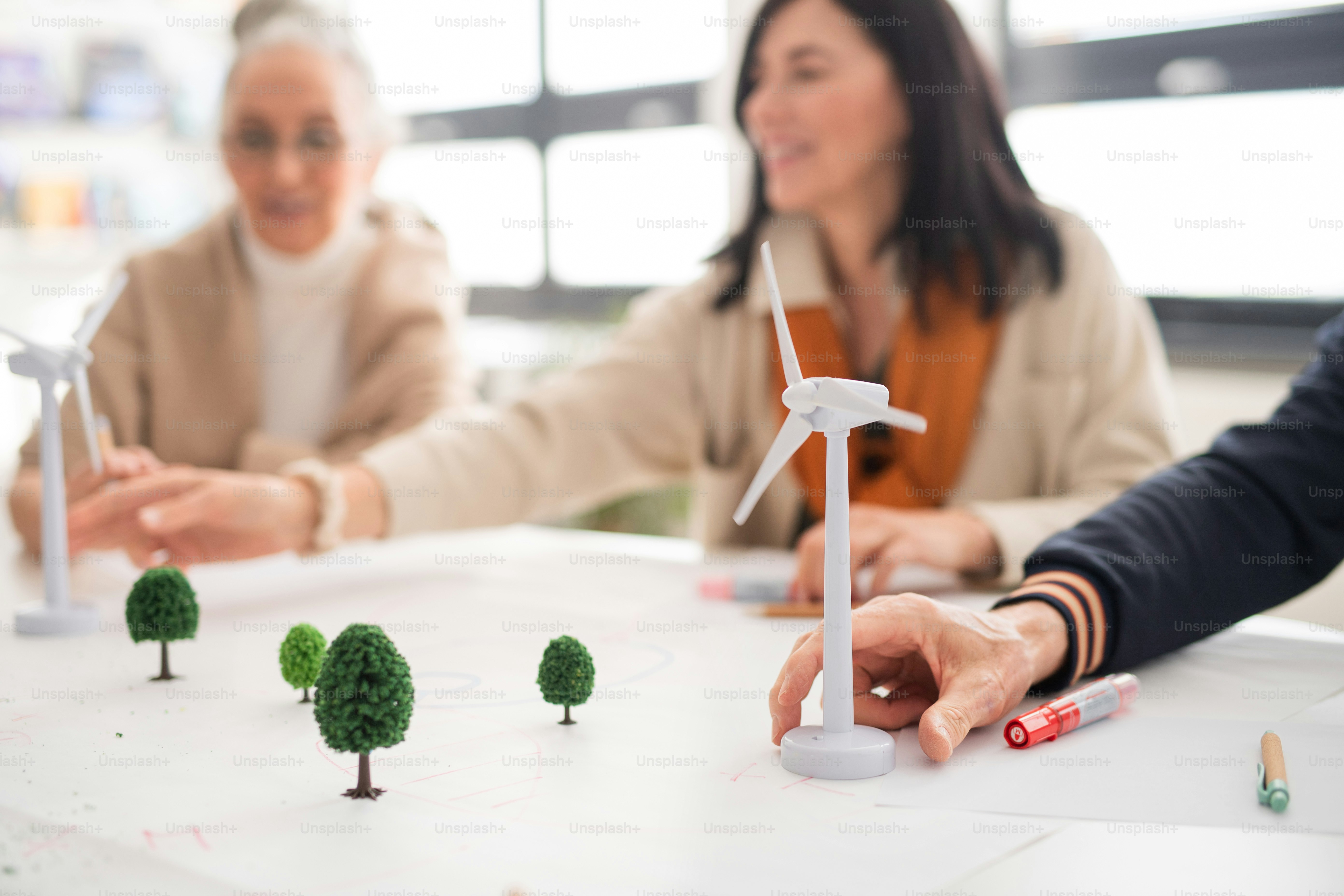 A university professor and students collaborating in a research lab.