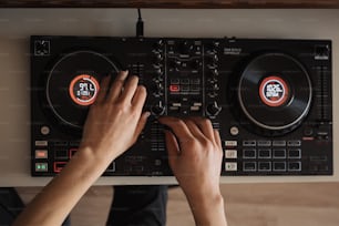 a person using a dj controller to play music