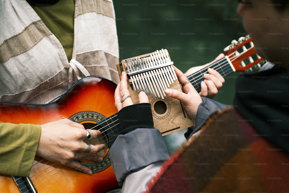 a man playing a musical instrument with a woman