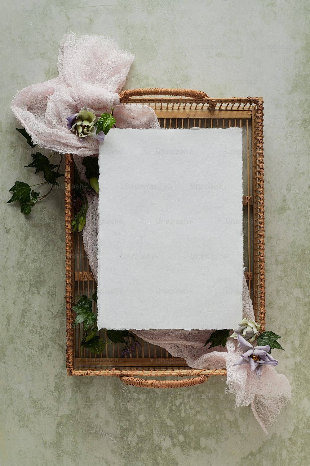 a picture frame with a white sheet of paper on it