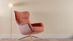 a pink chair sitting on top of a hard wood floor