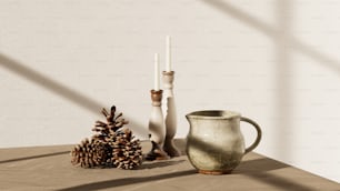 a table topped with a vase and a pine cone