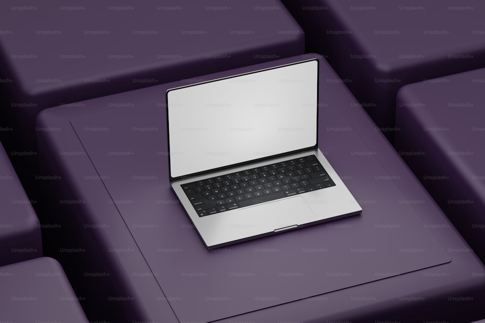 a laptop computer sitting on top of a purple couch