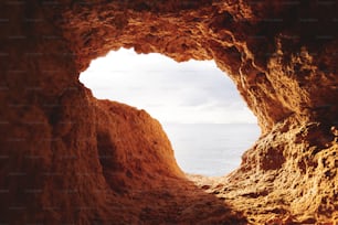 a view of the ocean from inside a cave