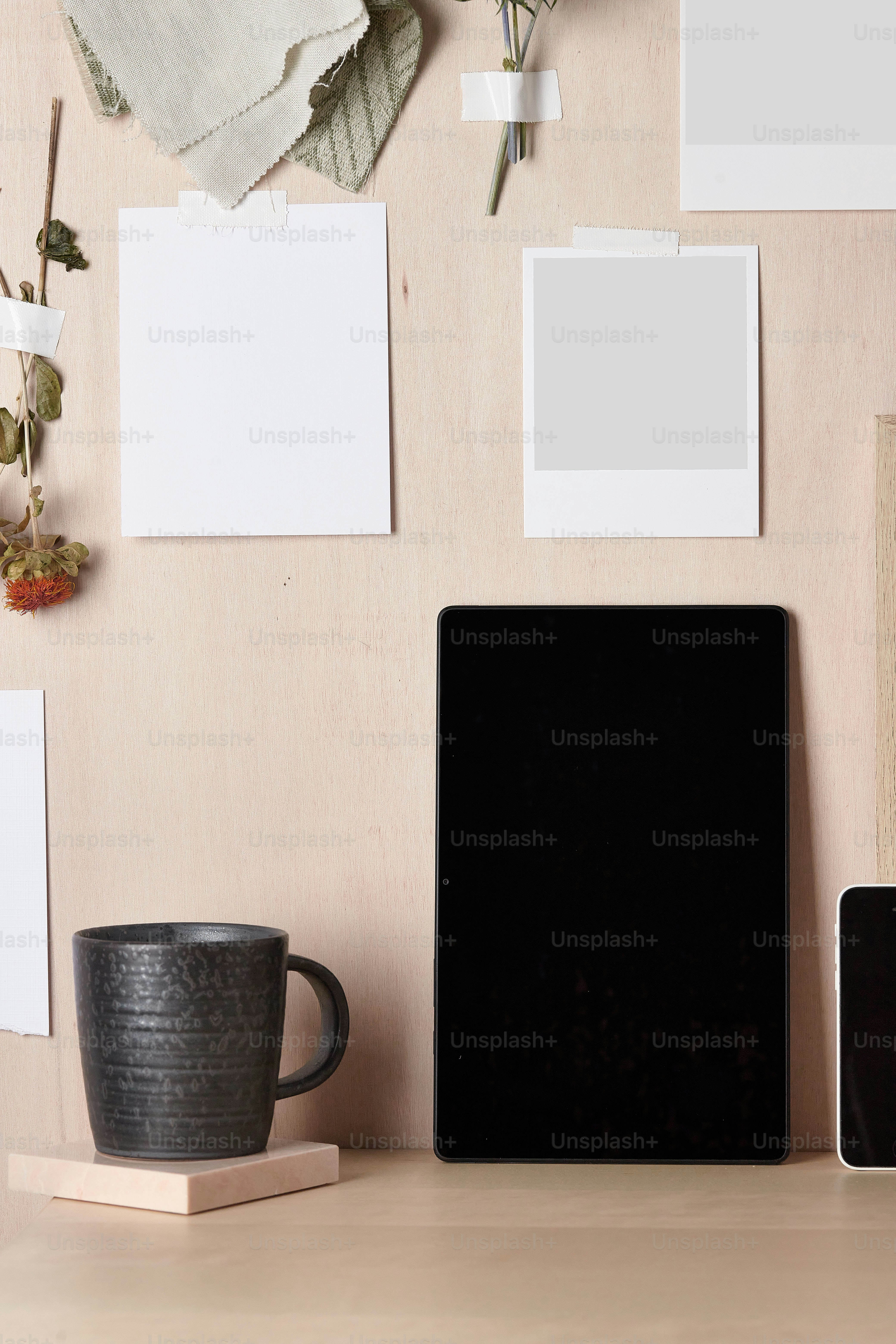 a laptop computer sitting on top of a wooden desk