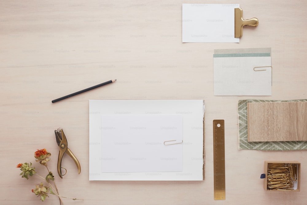 a table topped with lots of office supplies