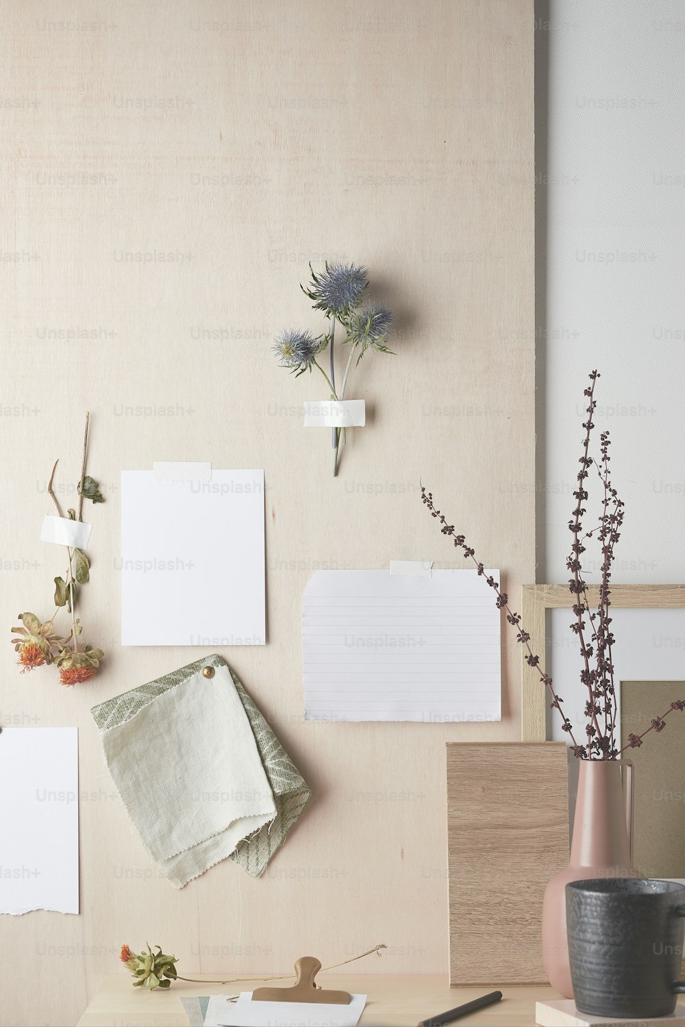 a table topped with a vase filled with flowers