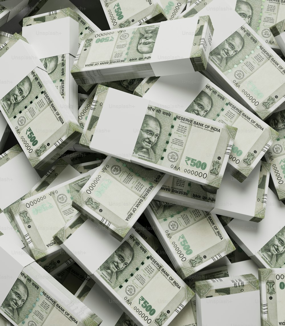 a pile of twenty dollar bills sitting on top of each other