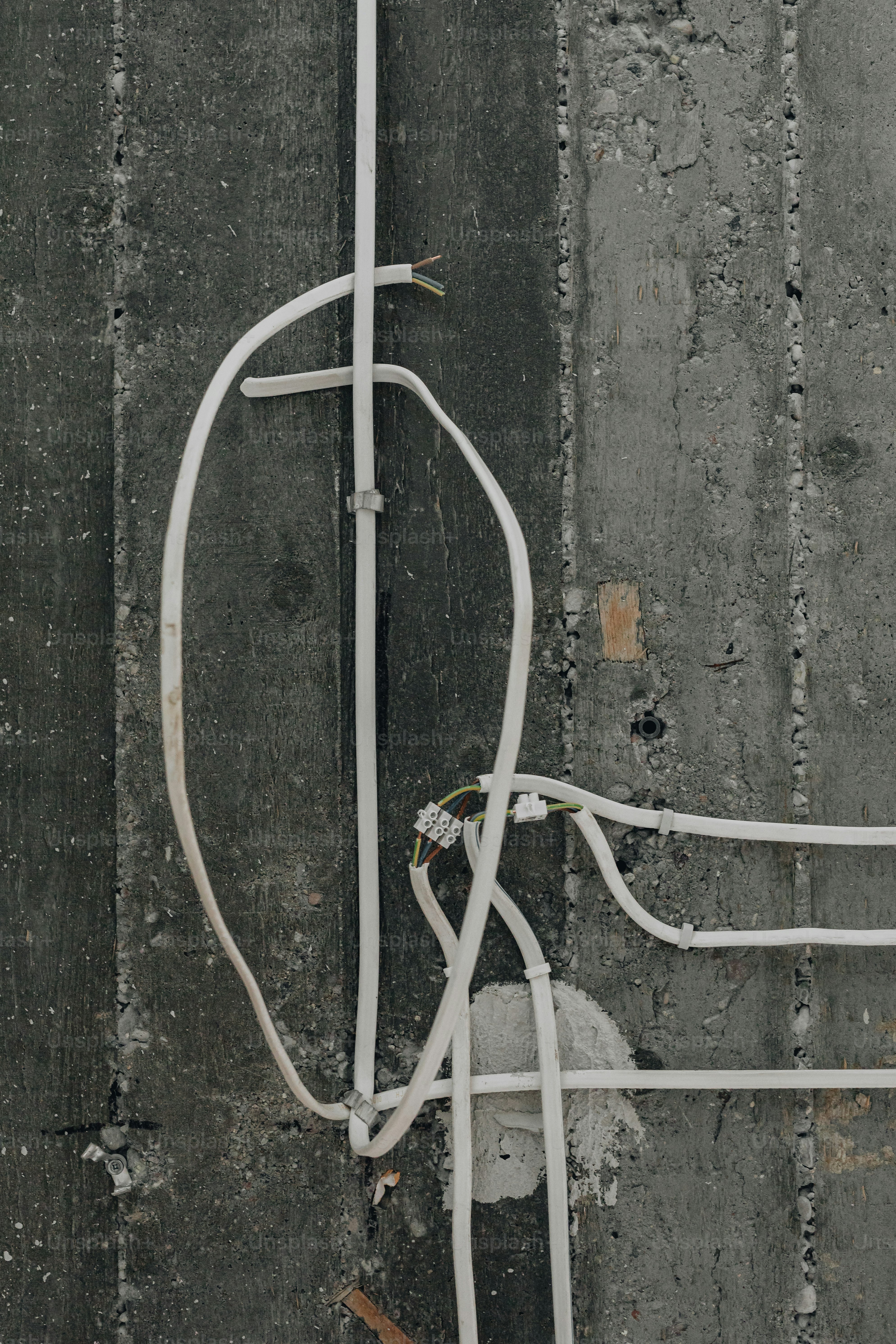 A couple of white wires connected to each other photo Wiring Image on Unsplash