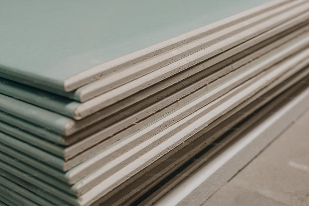 a stack of blue and white sheets sitting on top of each other