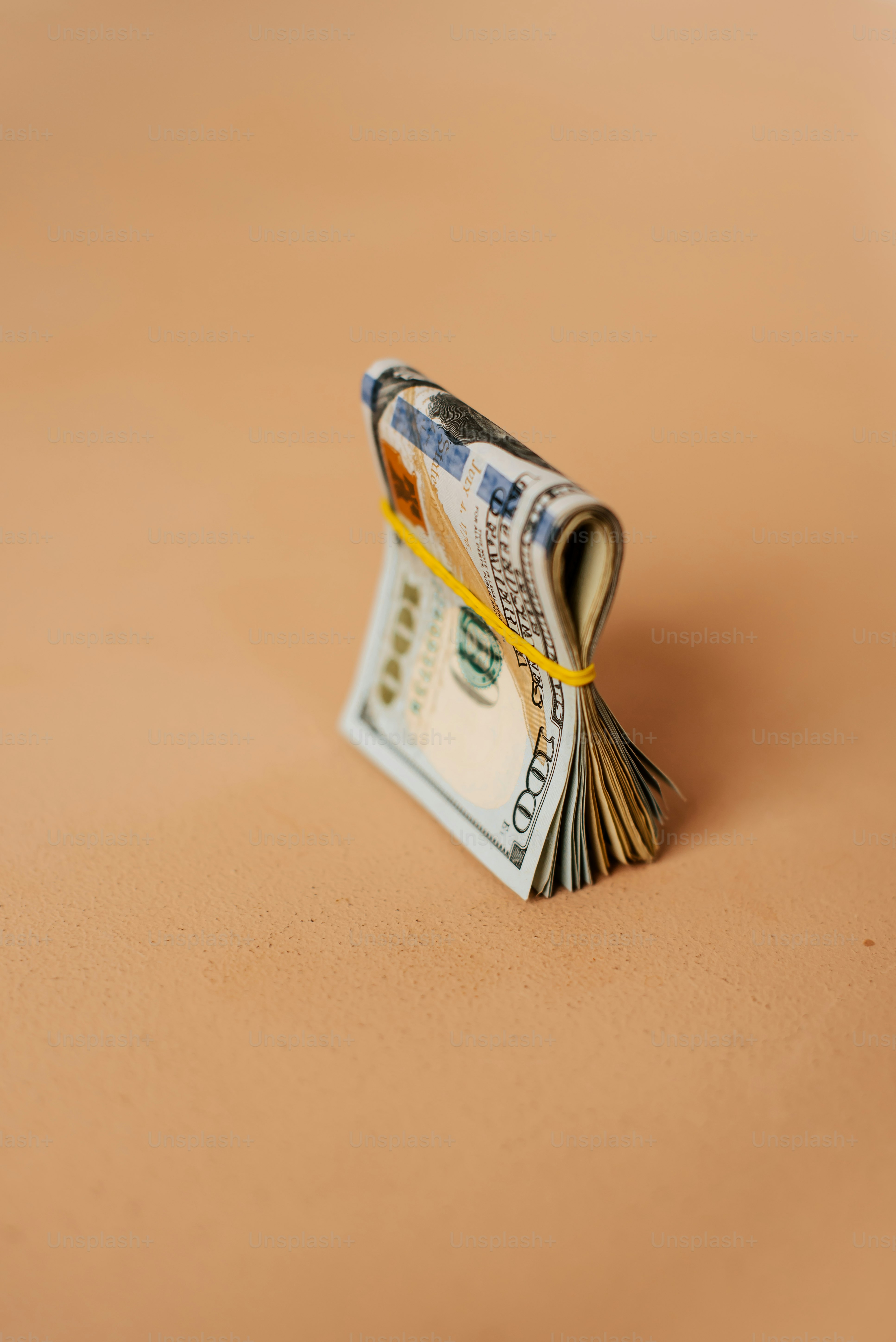 a stack of money sitting on top of a table