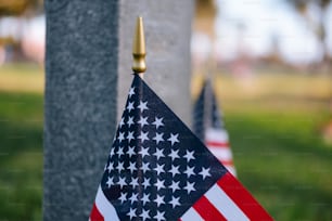a close up of an american flag on a pole