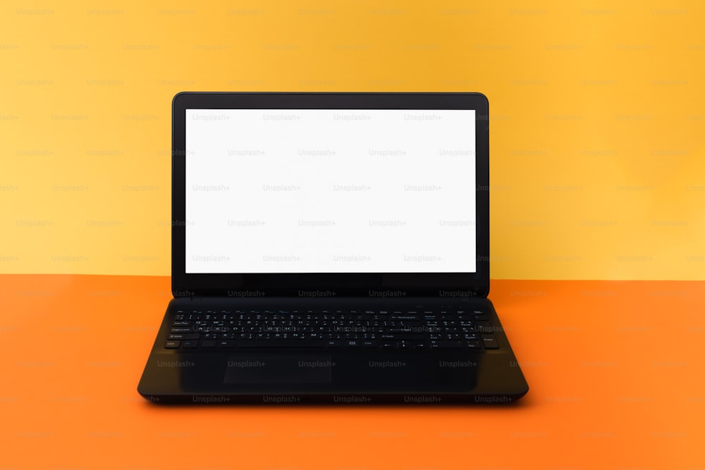 a laptop computer sitting on top of a table