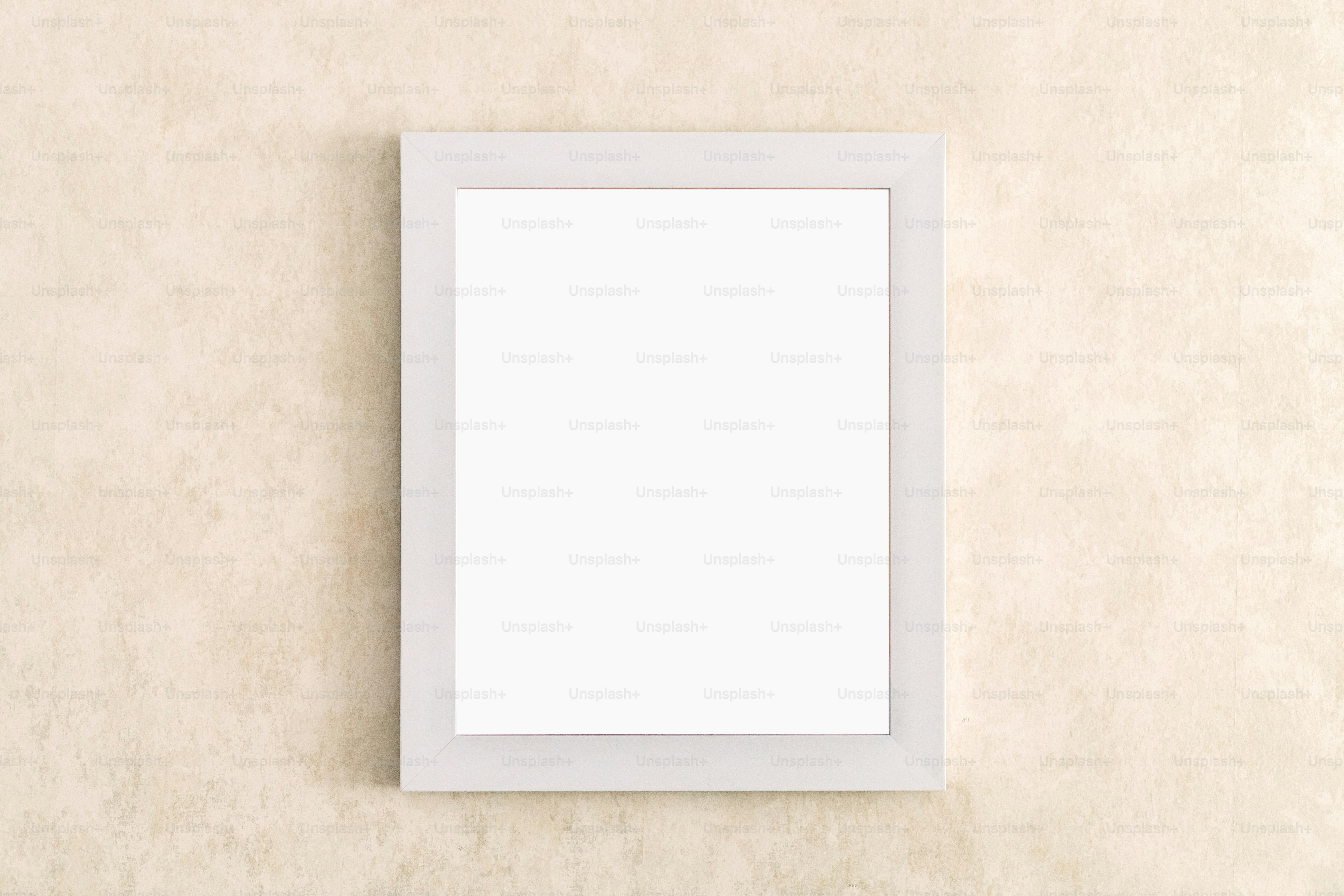 a white picture frame hanging on a wall
