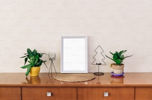 a picture frame sitting on top of a wooden dresser