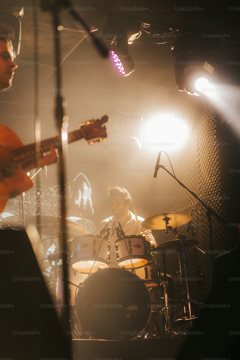 a group of people playing instruments on a stage