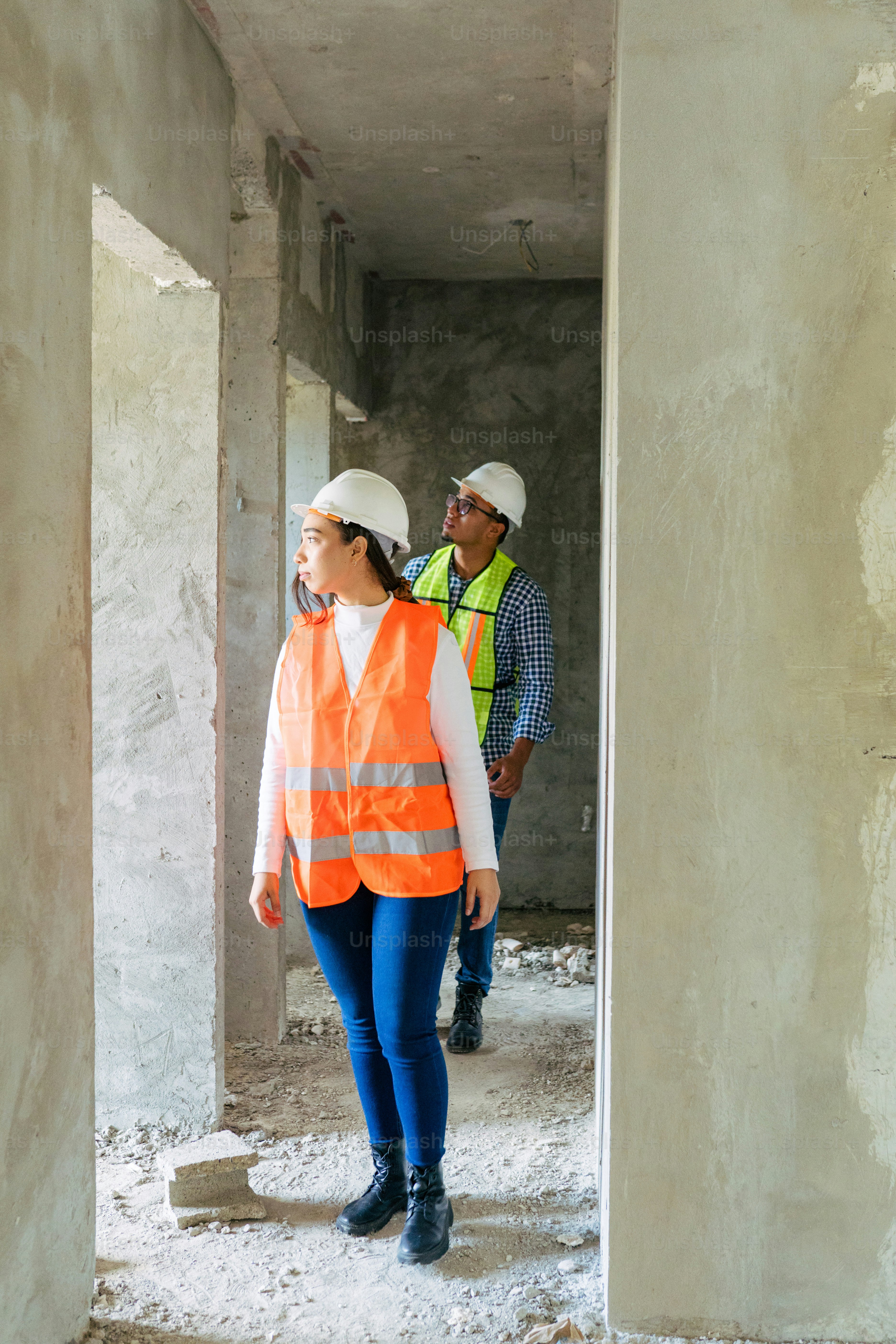 a couple of people that are standing in a building