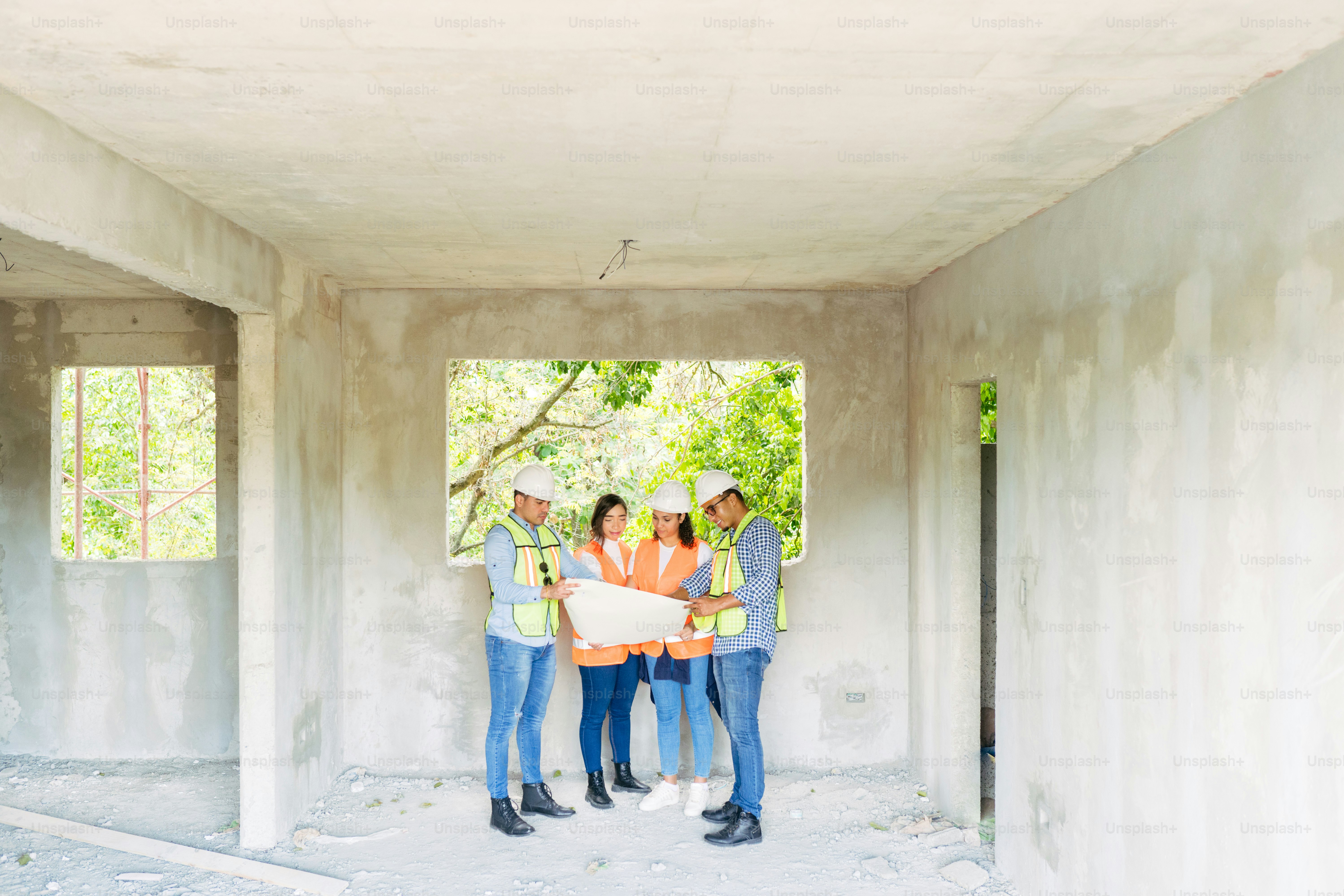 a group of people standing in a room under construction