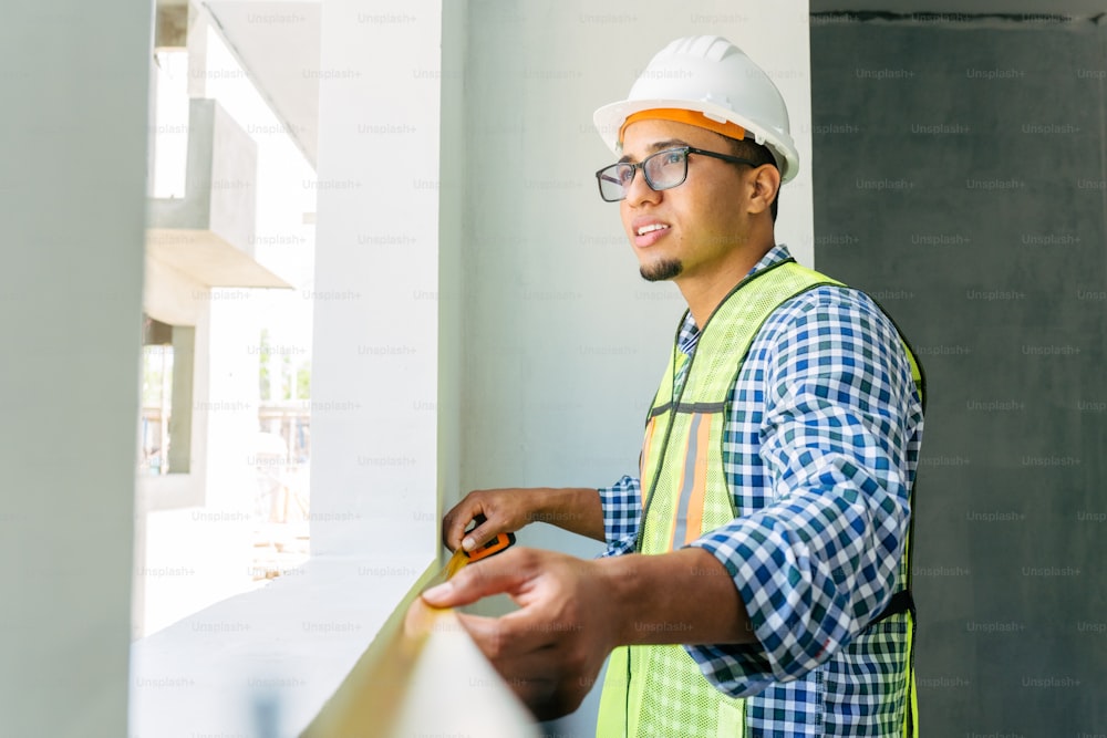 a man wearing a hard hat and safety vest