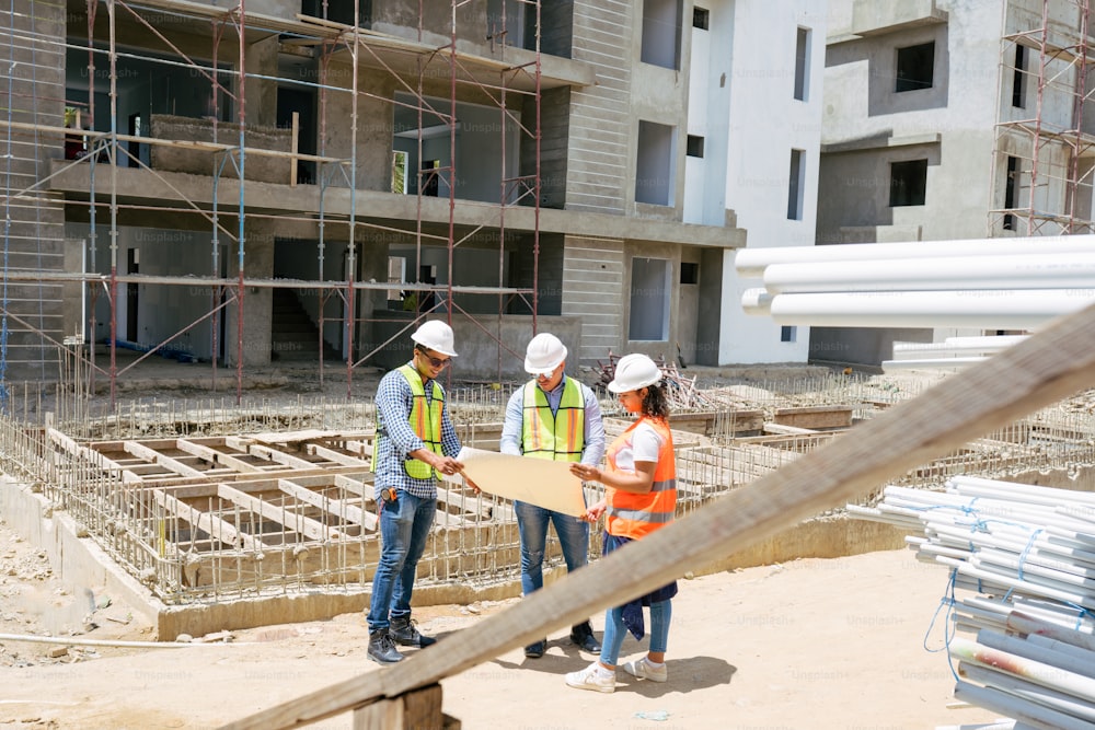 a group of people standing on top of a construction site