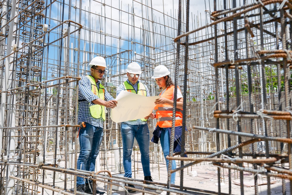 a group of people standing on top of a construction site