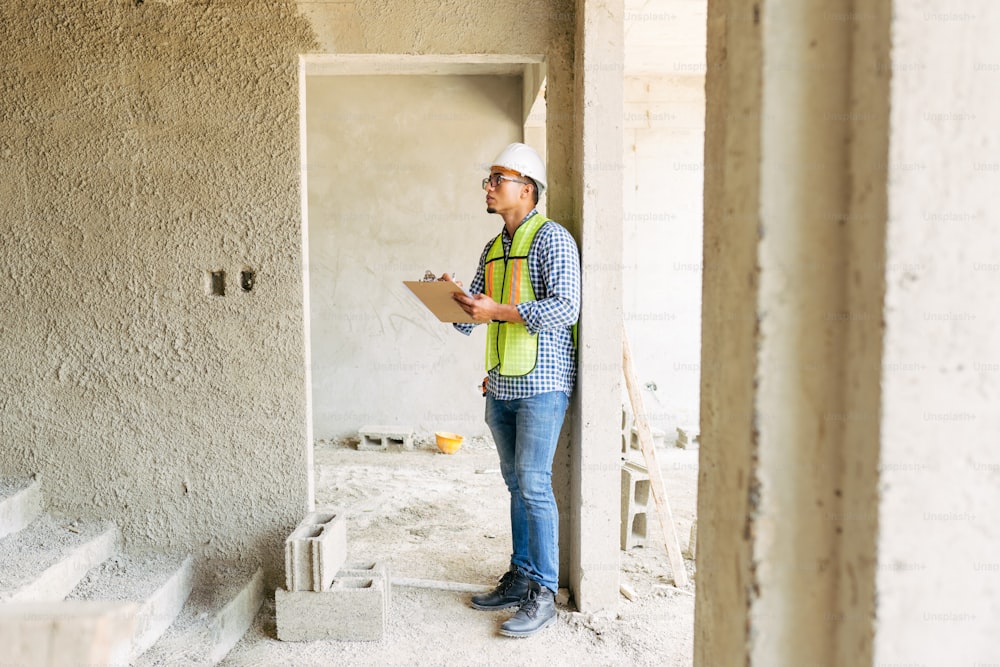 a man standing in a room under construction