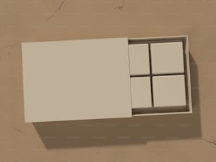 a white box with four square windows on a wall