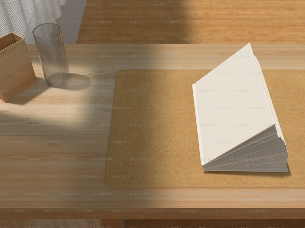 a stack of papers sitting on top of a wooden table