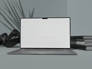 um computador portátil sentado em cima de uma mesa